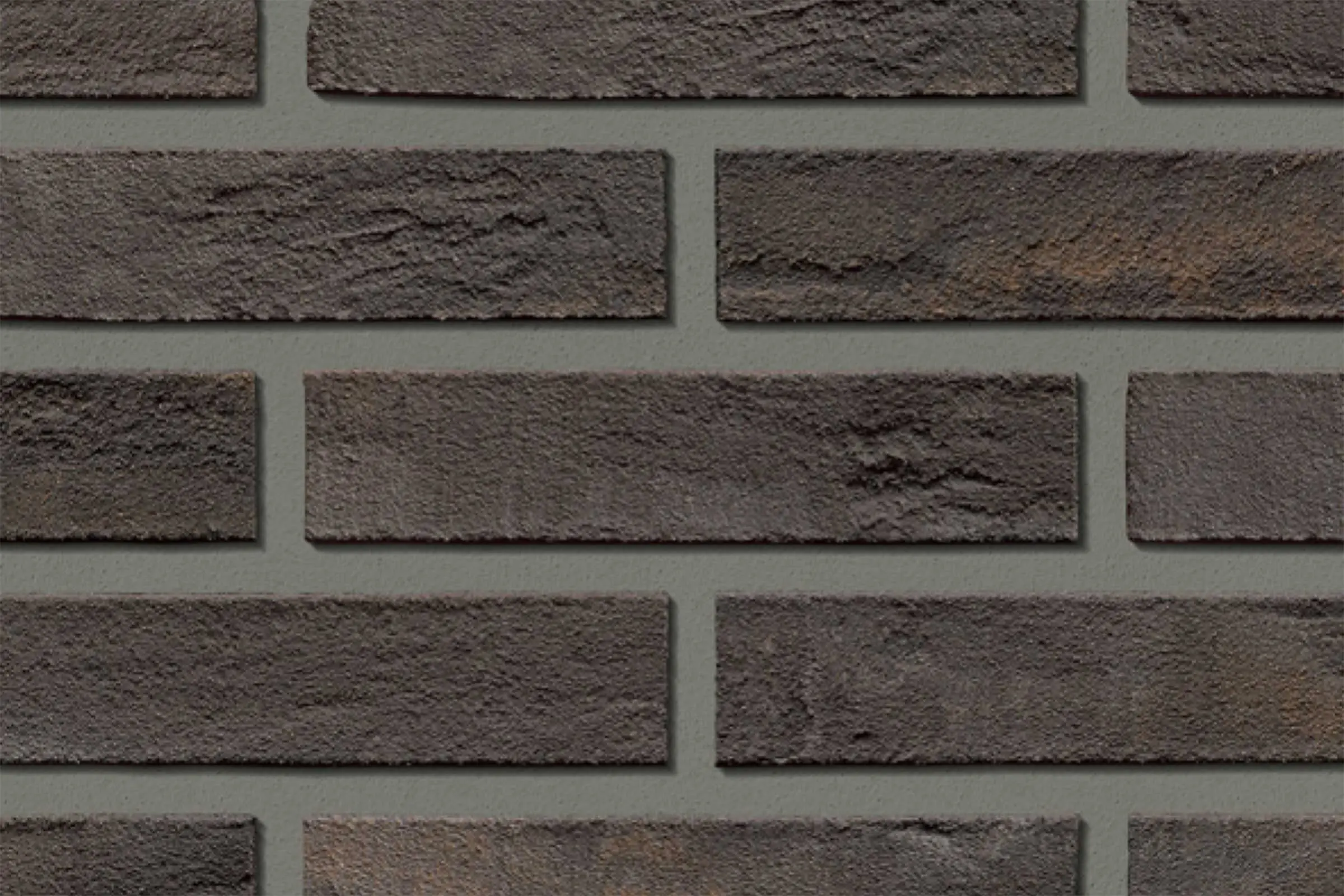 Dettaglio superficie rivestimento pannelli finto mattone per esterni grigio-marrone, StoCleyer B 31